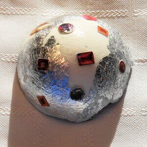 Handmade collages on a set of varnished eggshells